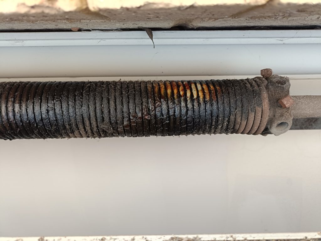 Broken garage door spring which needs replacing